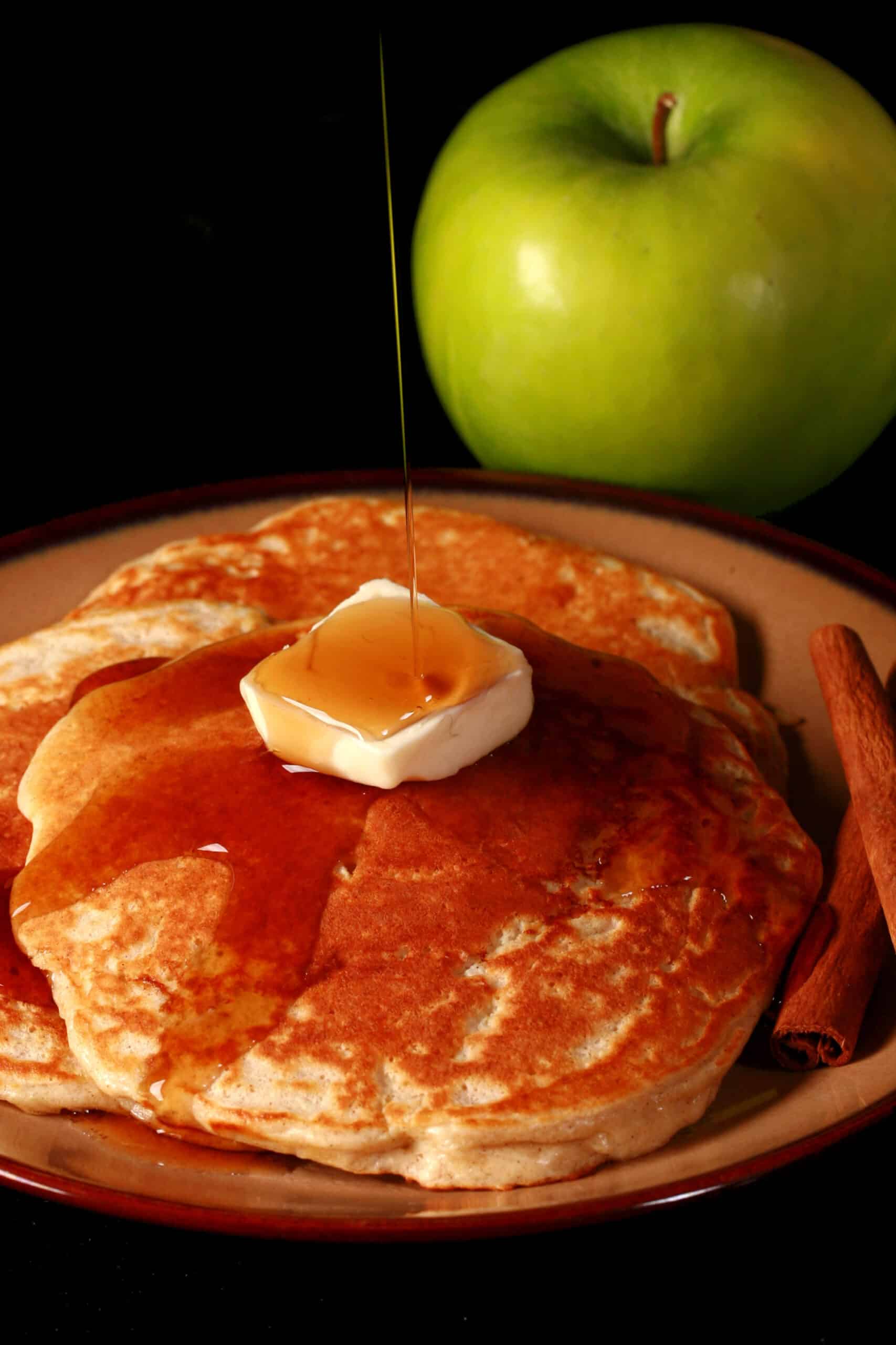 A plate of apple cinnamon protein pancakes.