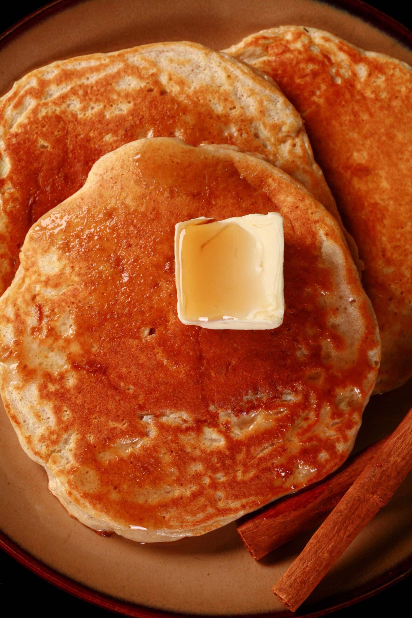 A plate of cinnamon apple protein powder pancakes.