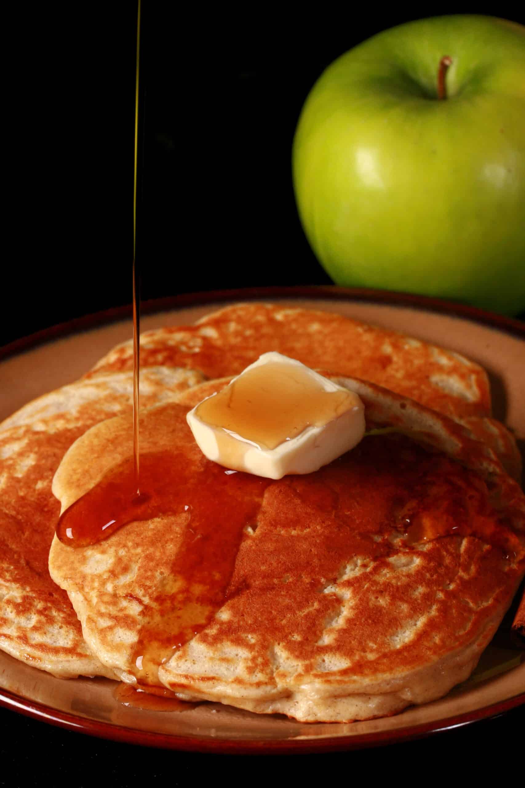A plate of apple cinnamon protein pancakes.