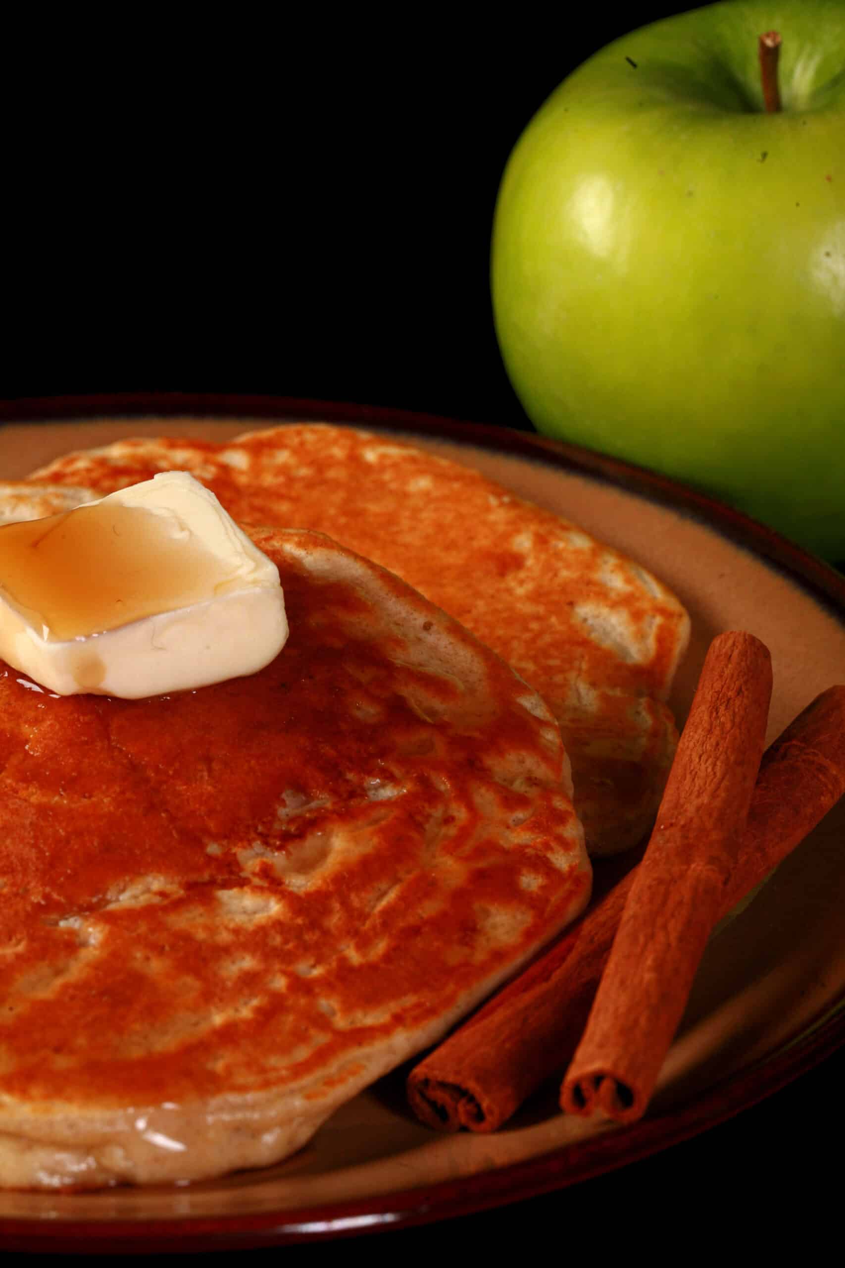 A plate of apple cinnamon protein pancakes.