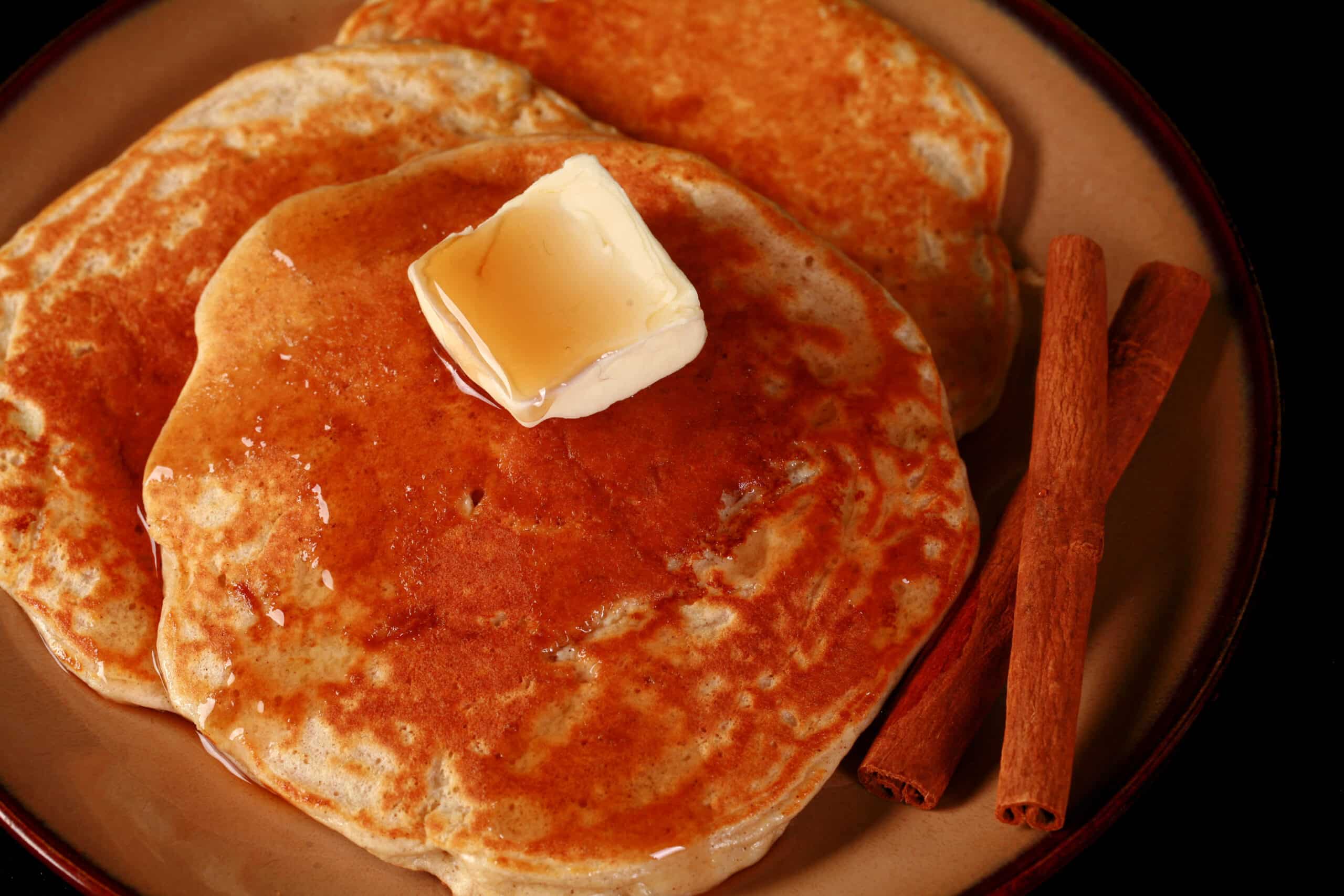 A plate of cinnamon apple protein powder pancakes.