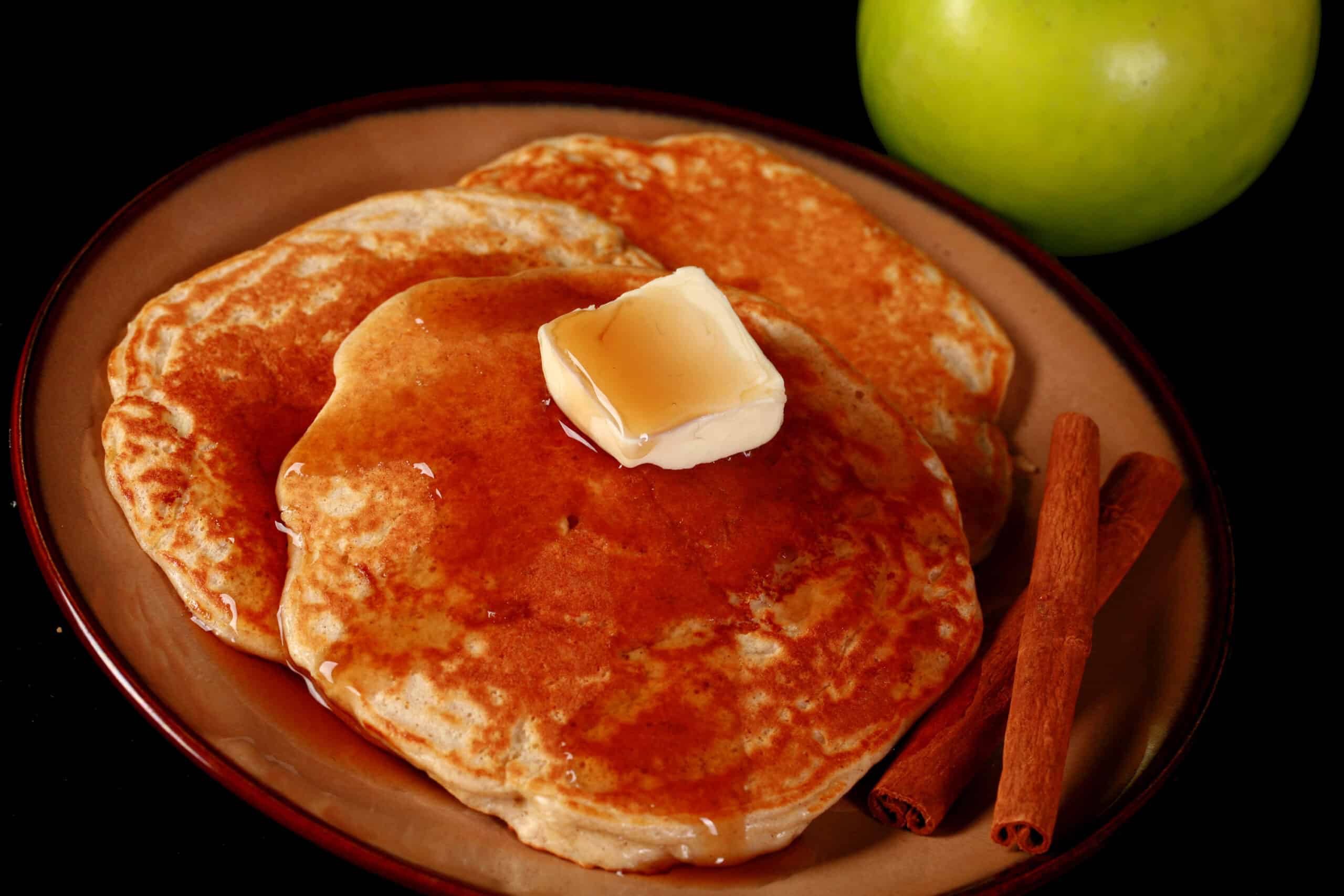 A plate of apple cinnamon protein pancakes.