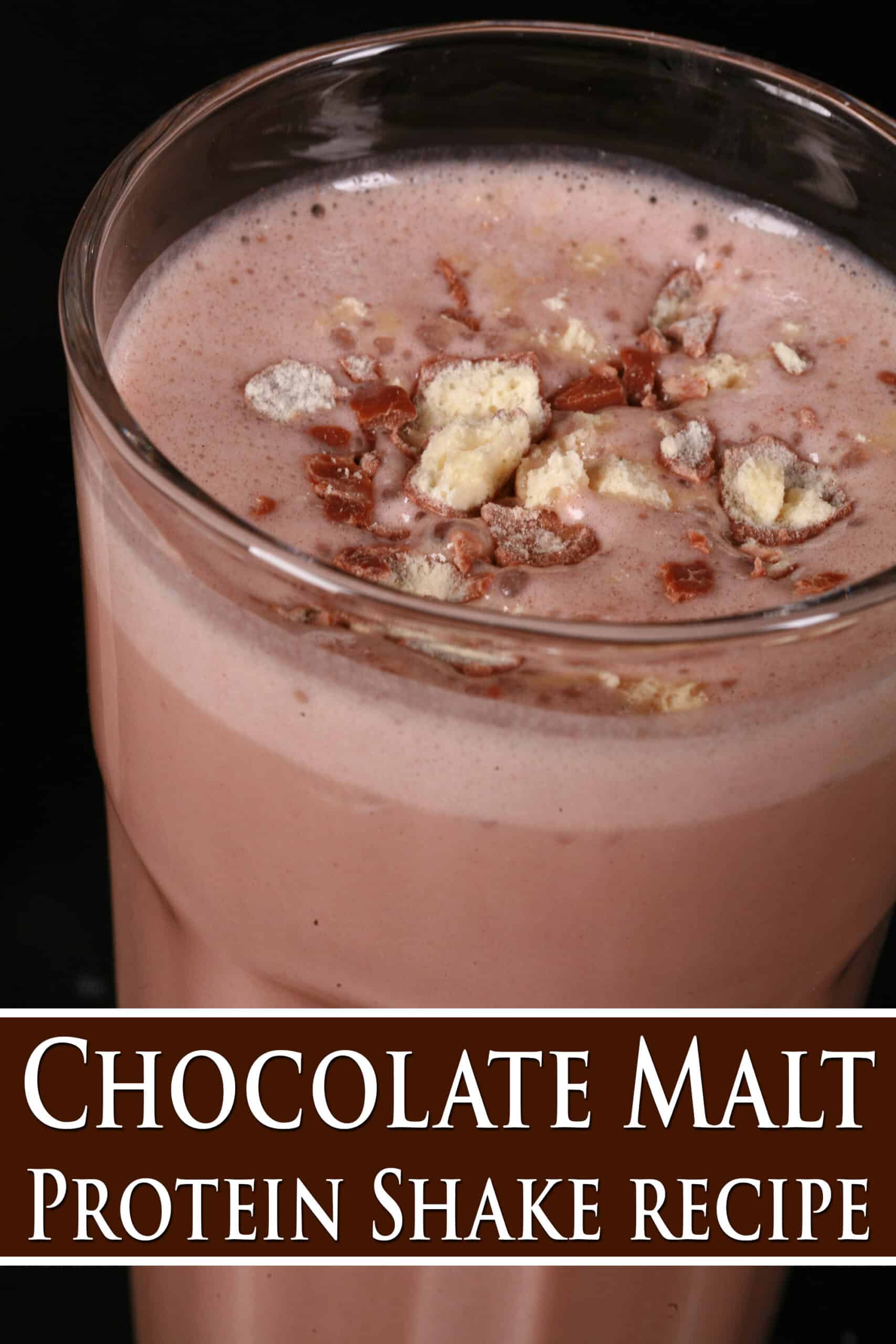 A tall glass of chocolate malted milk protein shake with crushed Whoppers Malted milk balls candy on top. Overlaid text says chocolate malt protein shake recipe.