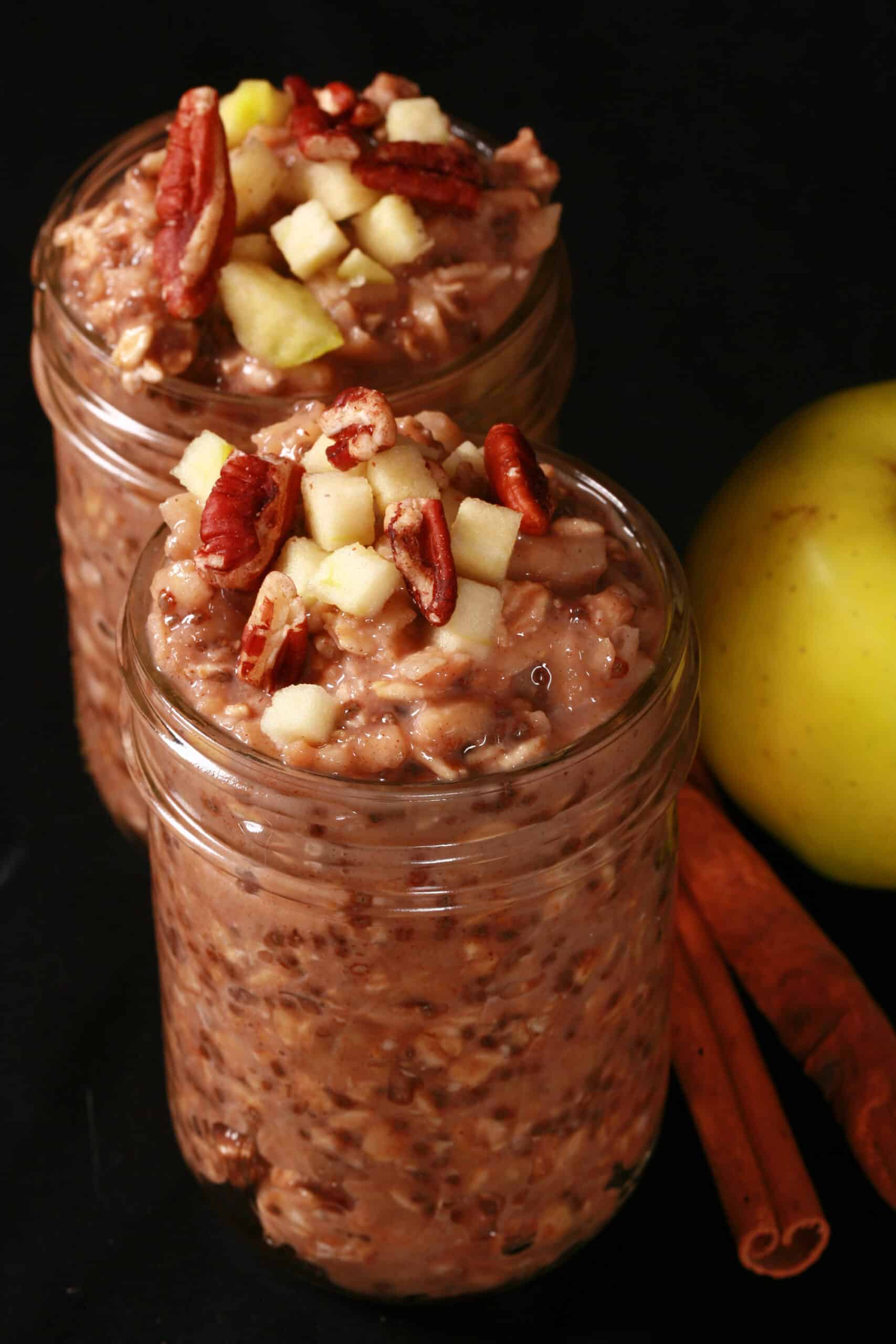 2 jars of high protein apple cinnamon overnight oatmeal, topped with chopped apples and pecans.