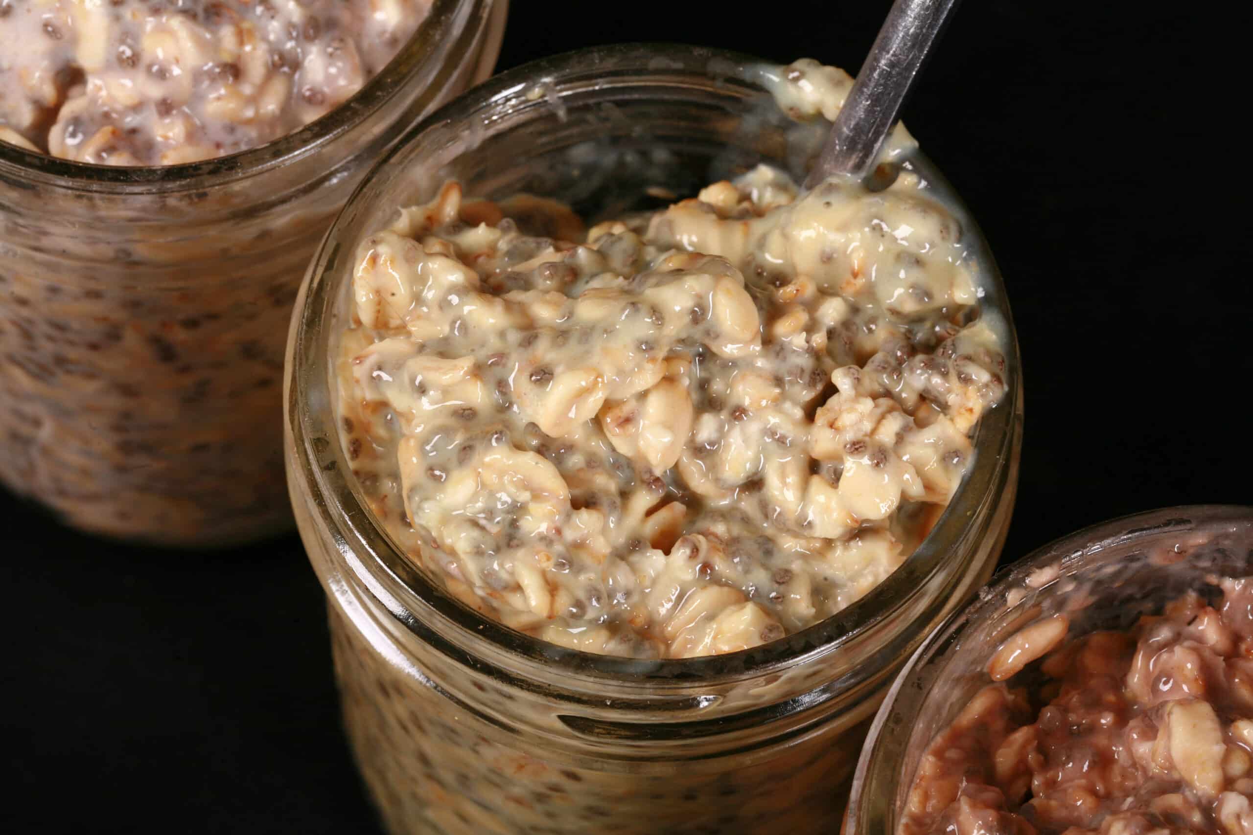 3 jars of different flavours of protein powder overnight oats.