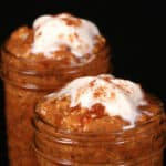 2 jars of high protein pumpkin overnight oats, topped with whipped cream and pumpkin spice.