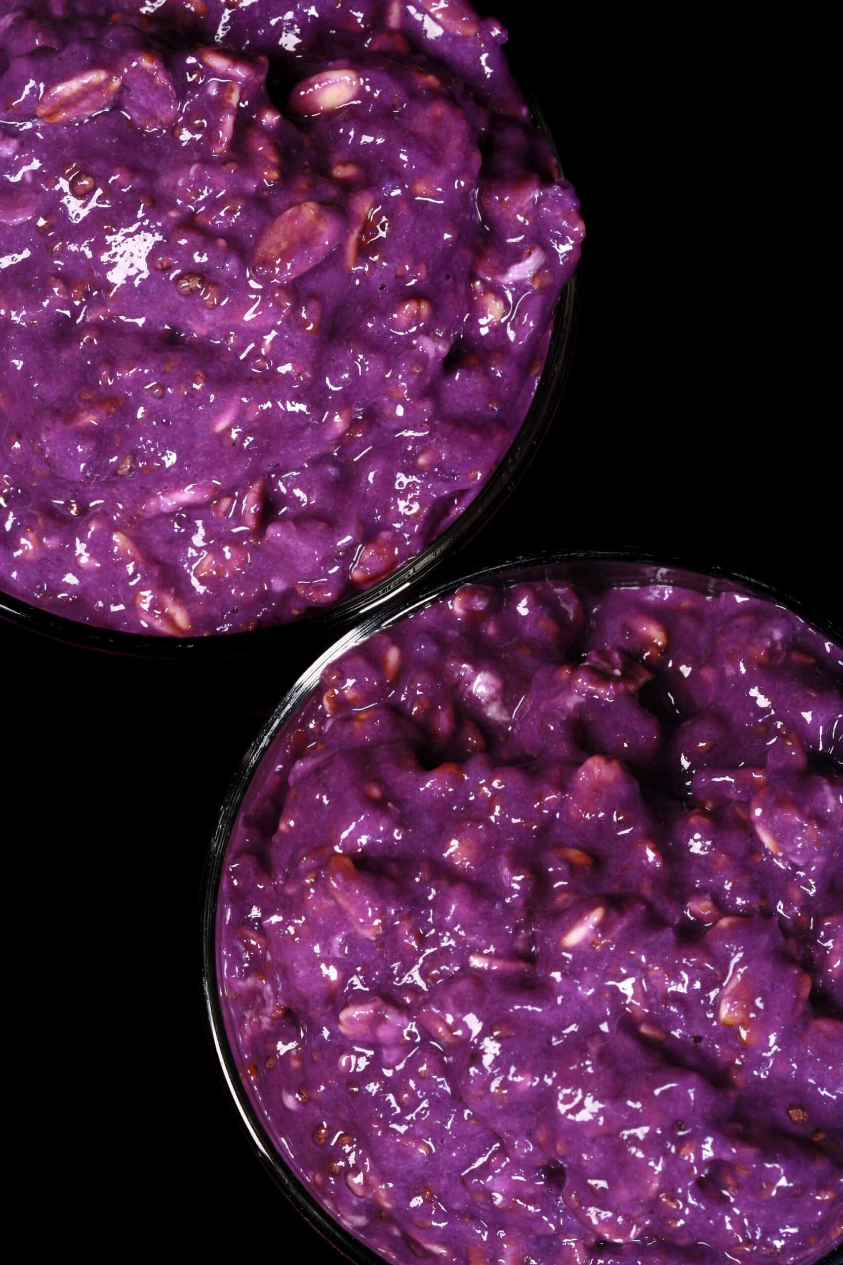 2 mason jars of bright purple high protein Ube Overnight Oats.