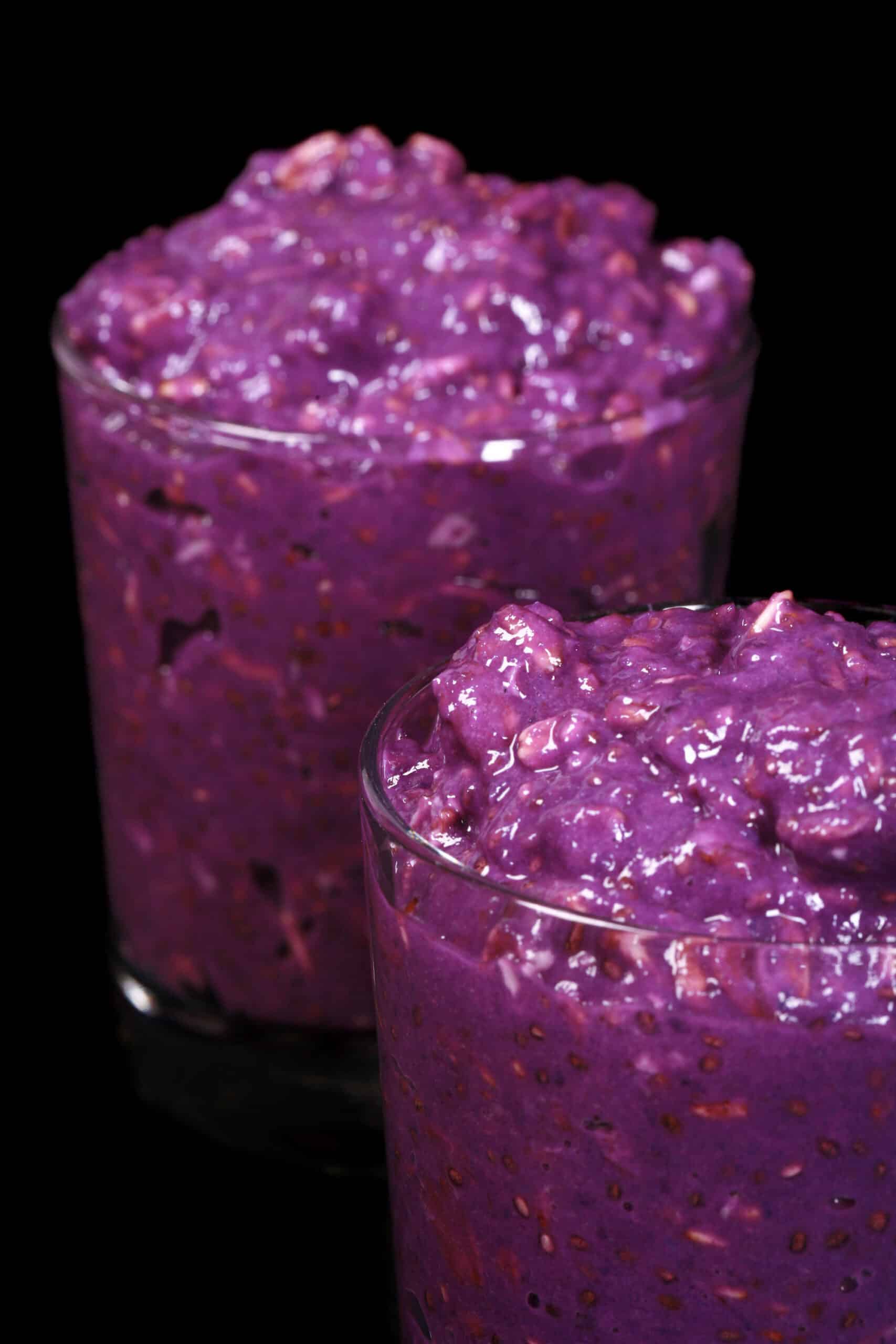 2 mason jars of bright purple high protein Ube Overnight Oats.
