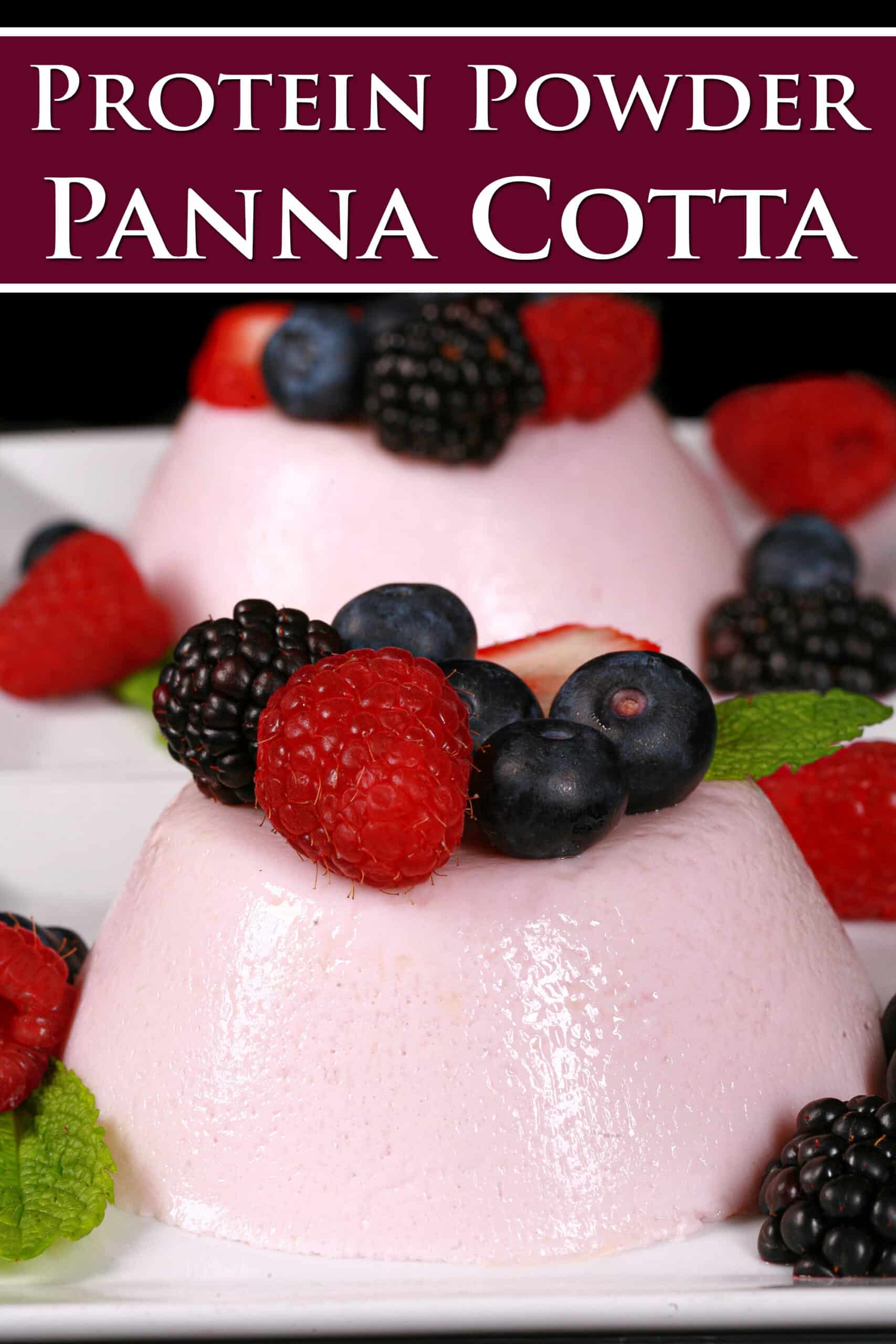 2 light pink high protein panna cotta servings on plates, with mixed berries and mint leaves. Overlaid text says protein powder panna cotta.