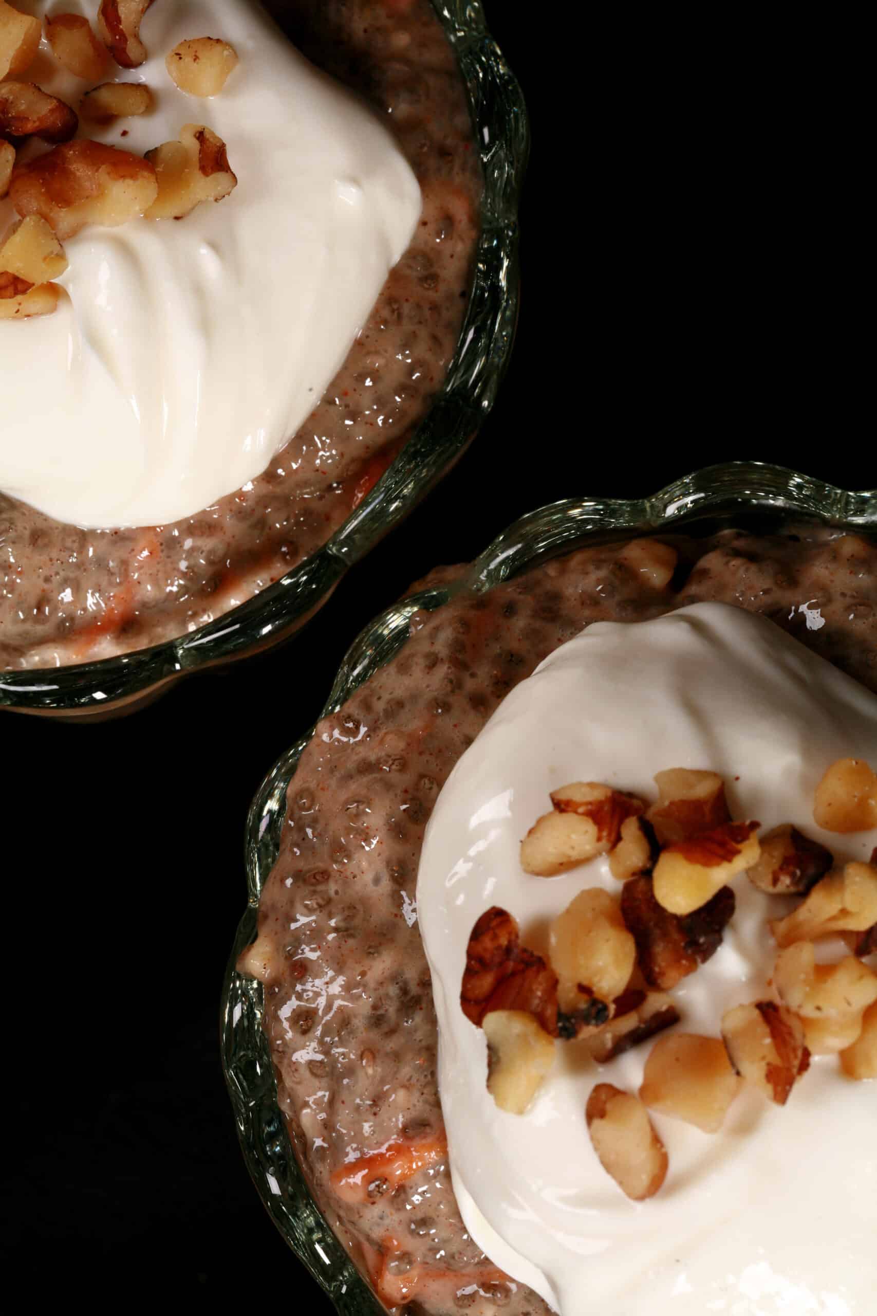 2 dessert cups of carrot cake high protein chia pudding, topped with cream cheese Greek yogurt topping and chopped walnuts.