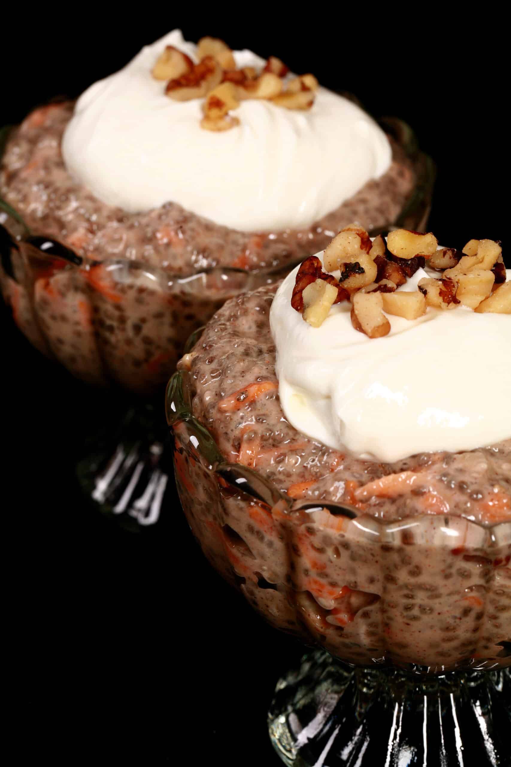 2 dessert cups of carrot cake high protein chia pudding, topped with cream cheese Greek yogurt topping and chopped walnuts.