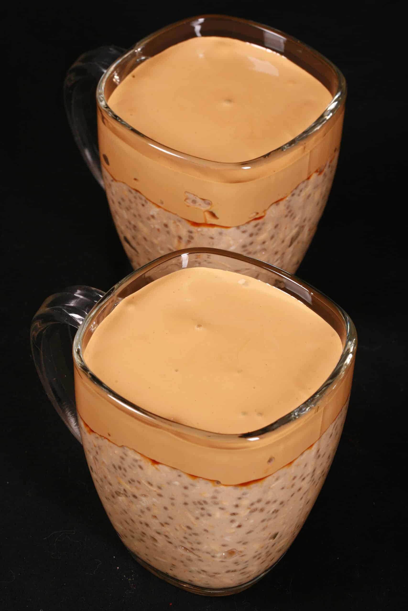 2 mugs of High Protein Dalgona Coffee Overnight Oats.
